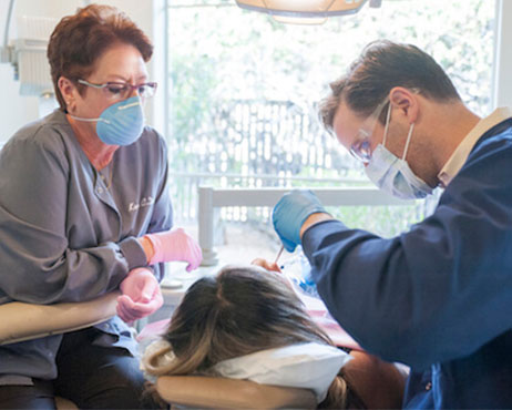 Doctor extracting wisdom teeth