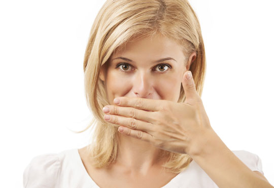 Woman covering mouth